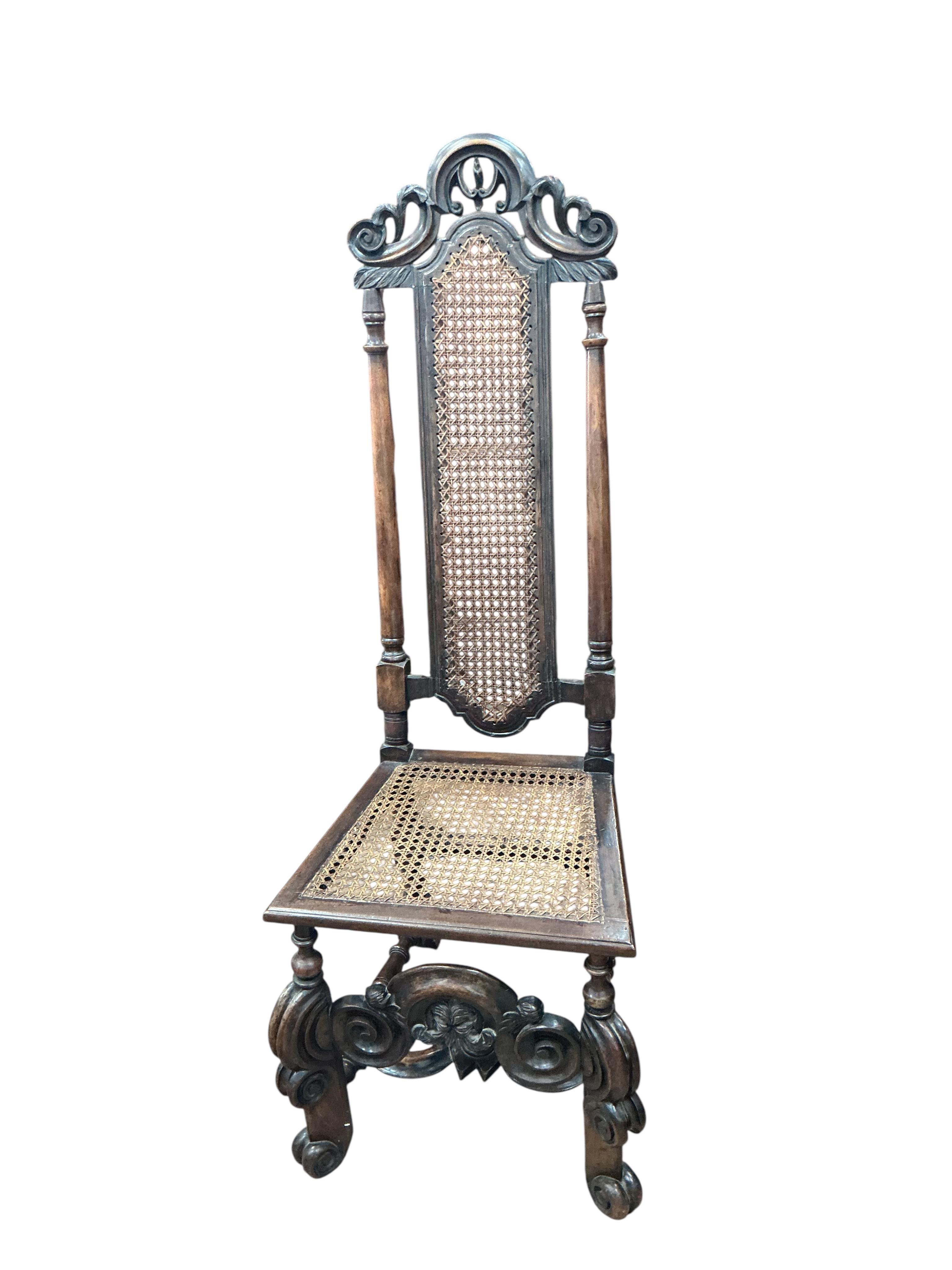 A pair of William and Mary walnut and cane work side chairs, width 46cm, depth 48cm, height 116cm